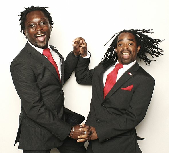 Darion and Brenton happily dancing in matching suits