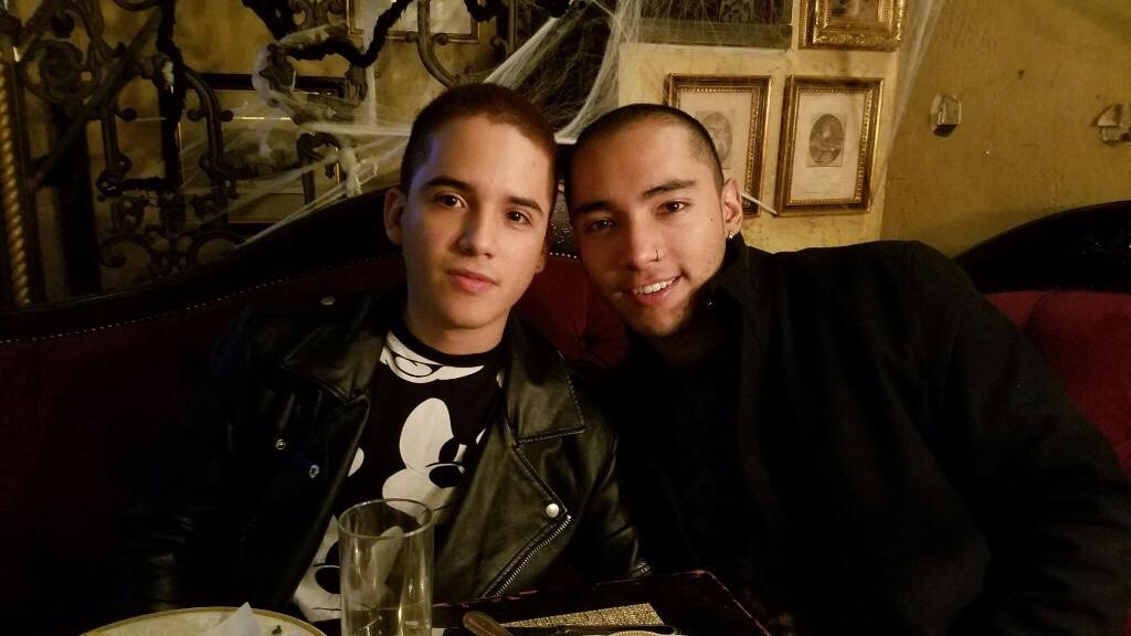 Marlon and Julian smiling, posing for a picture, looking happy together